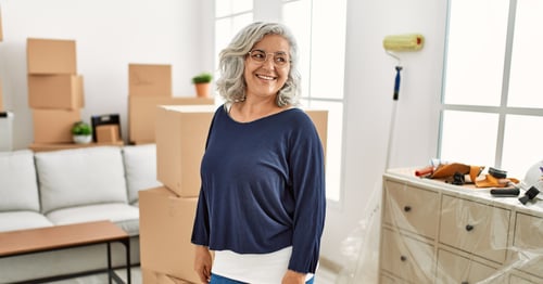 Latina Woman Moving Downsizing Packing Boxes 